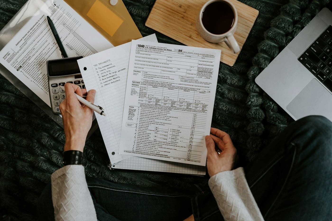 Financial statements, a calculator and a pen on a desk